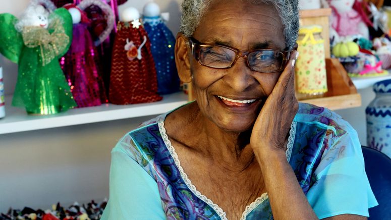 Dementia planning- Older Indian lady posing and smiling for the photo