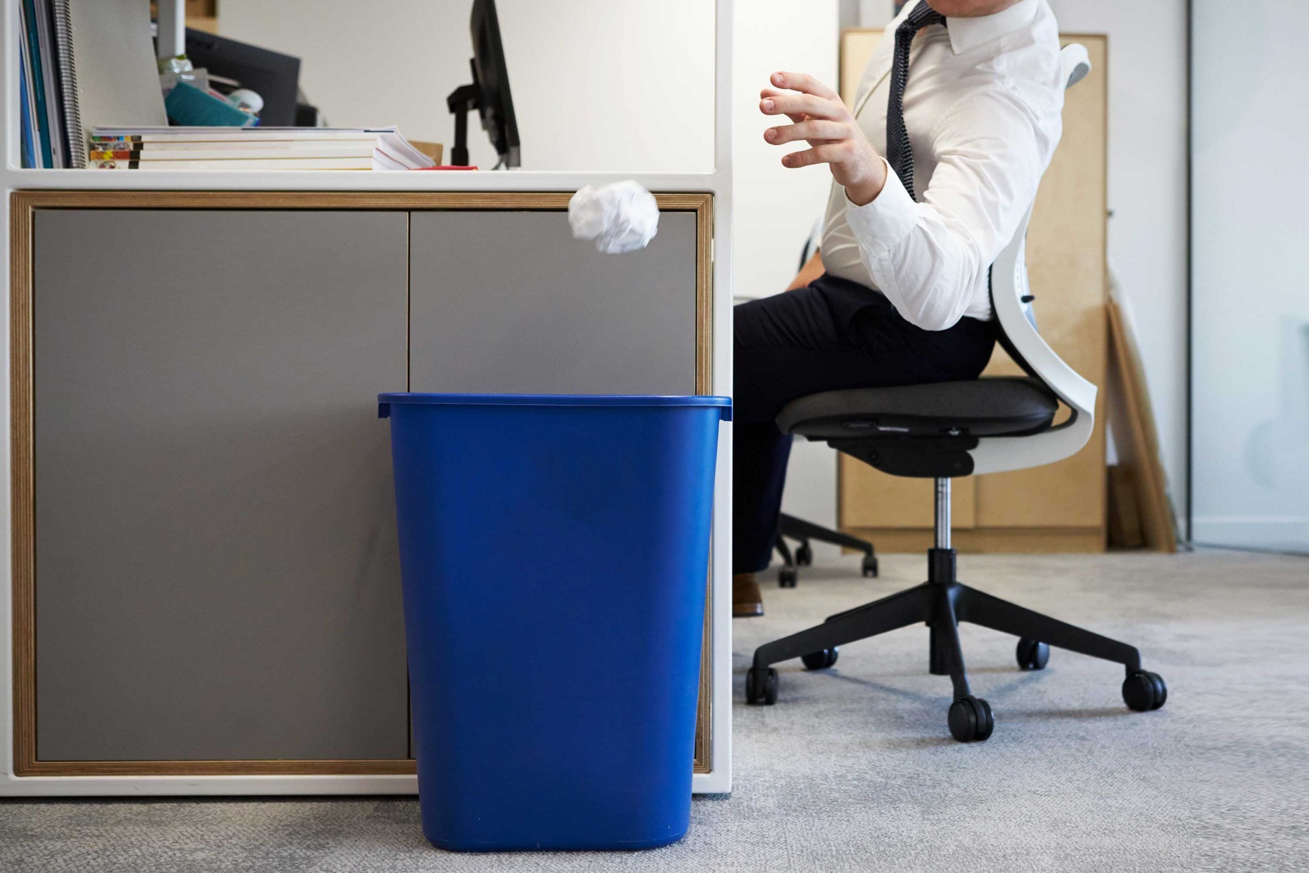 Employee Throwing Away Recycling in Office by Recycling Trash Systems