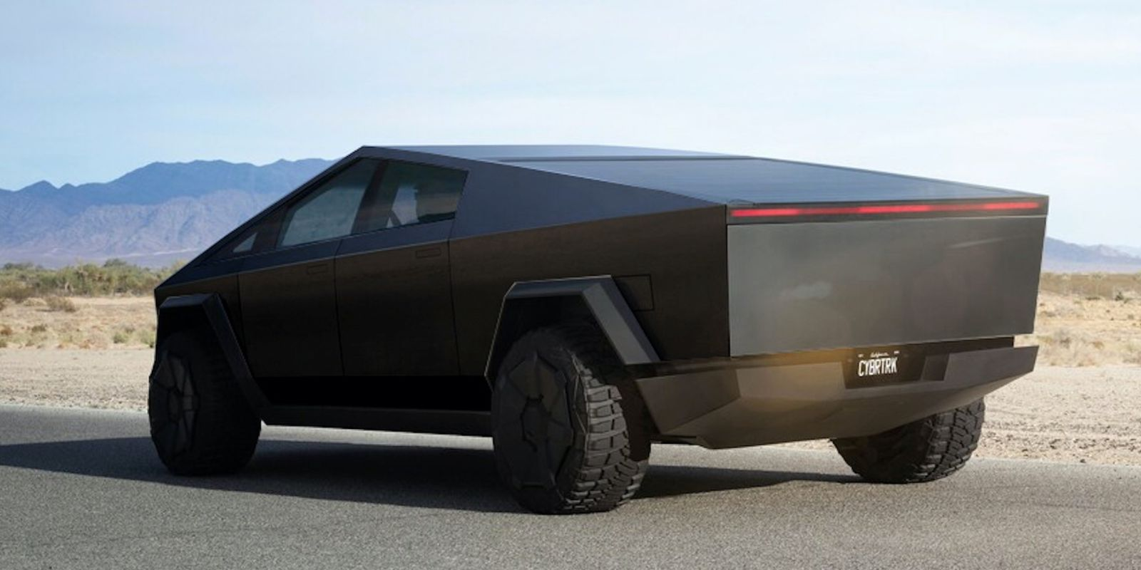 Auto znacky Tesla stojici na ceste