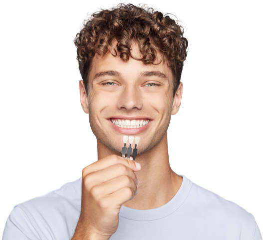 Young man with colour scale for dental Veneers