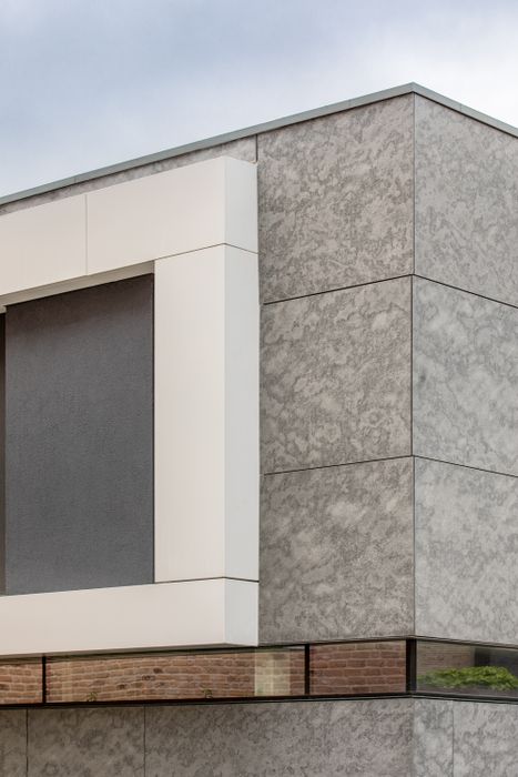 Ardonit natural grey slates and Puro Plus facade panel