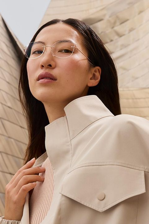 Woman in front of the Guggenheim Bilbao Museum wearing The Refined collection