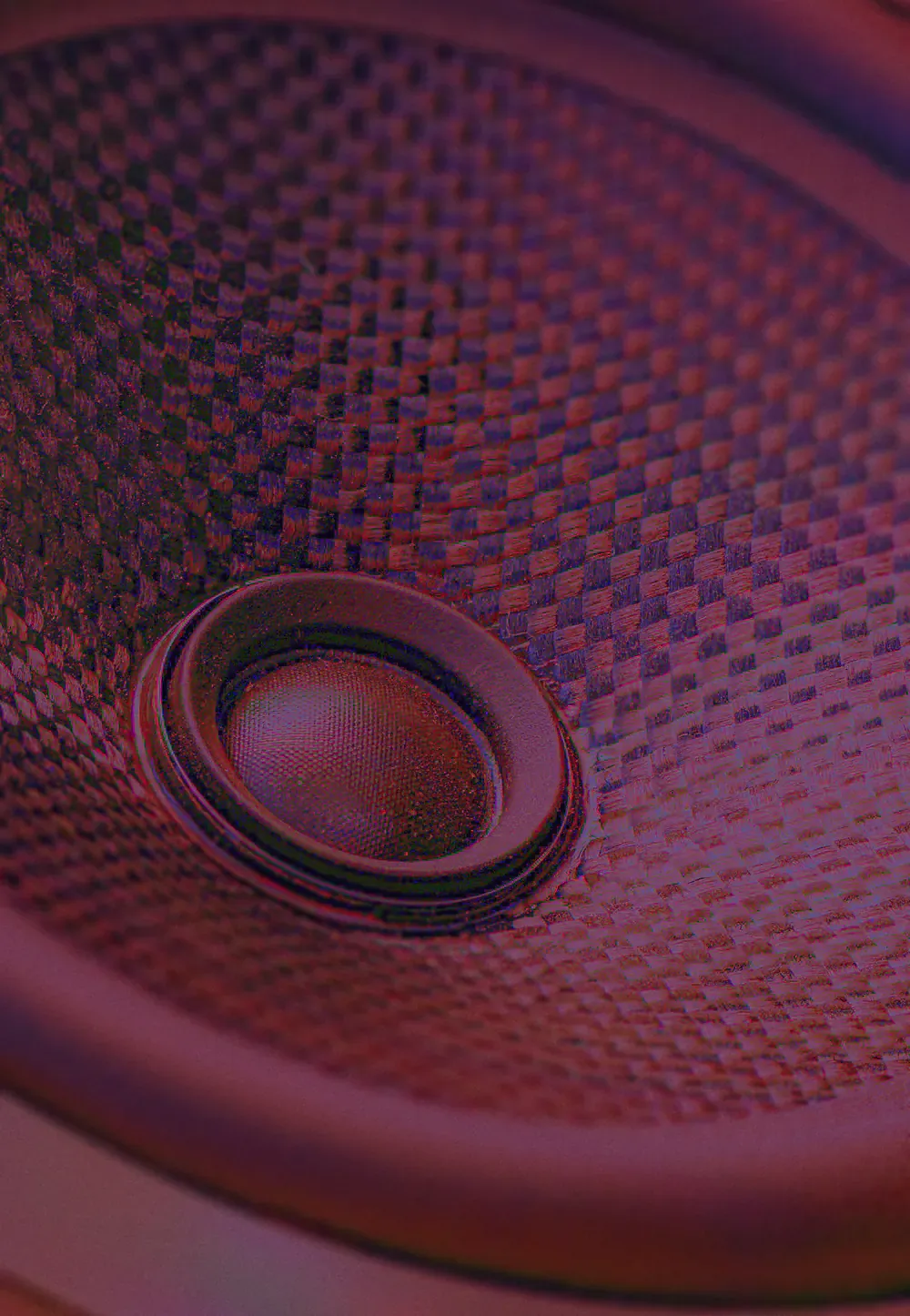 Close-up of a studio speaker cone lit in red, from the Sound of CRA campaign