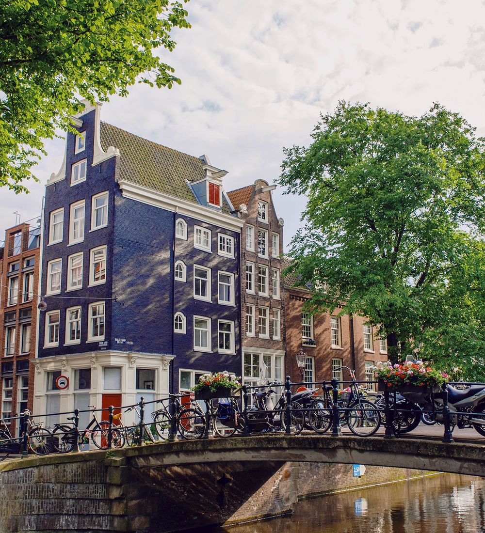 Buildings situated over canal and bridge in Amsterdam