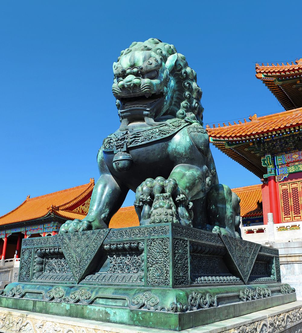 Bronze lion in front of the Forbidden City in Beijing China