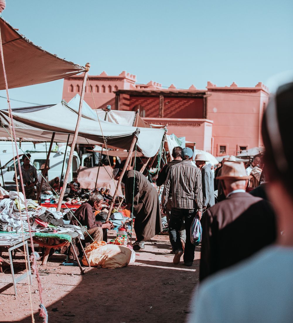 people in a berber market in marrakesh morocco