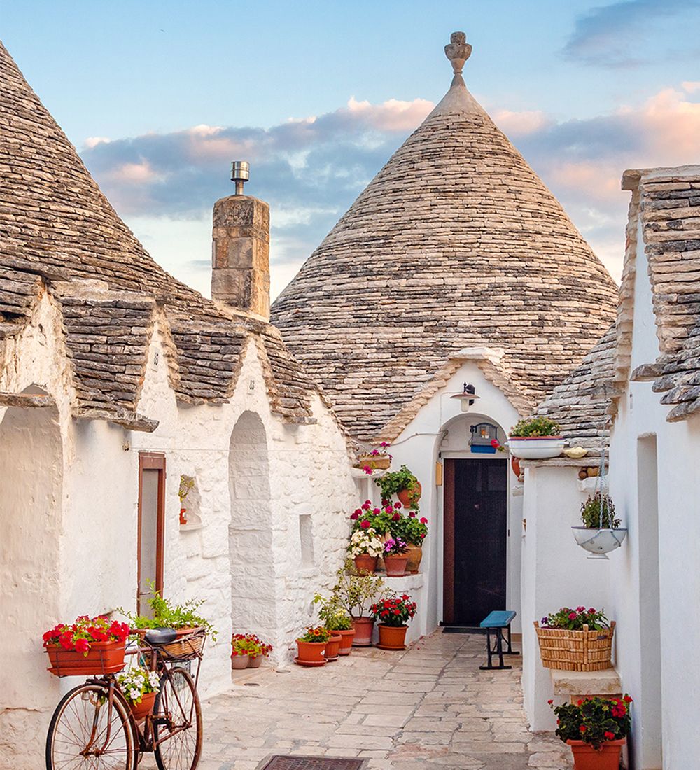 Street view of traditional Apulian dry stone huts in Puglia Italy
