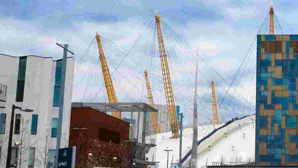 o2 arena and surrounding buildings on a sunny day