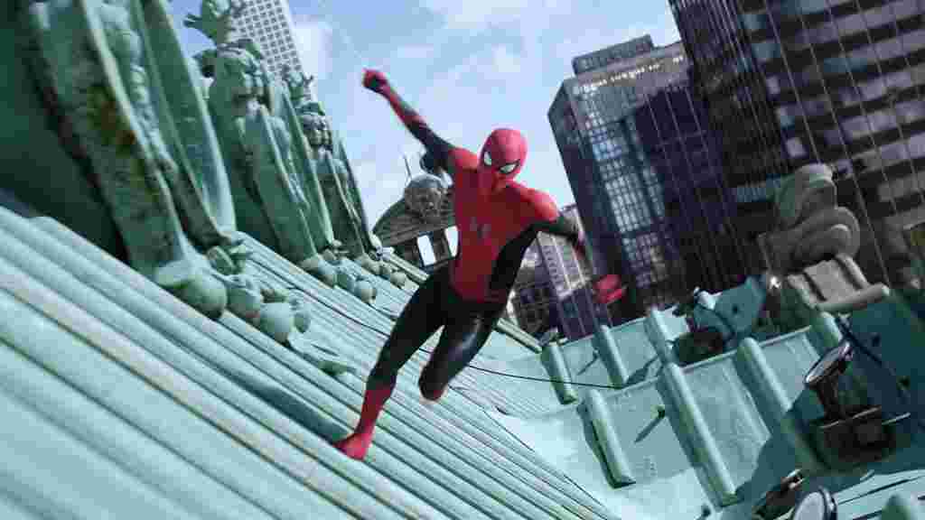 Spiderman character running along green roof