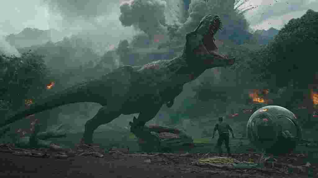 A tyrannosaurus rex roaring with a volcano exploding behind them