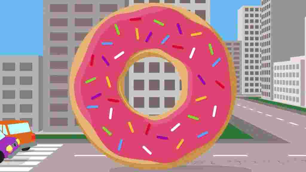 A cartoon pink doughnut rolling through skyscrapers