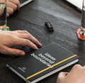 Abstraction notebook with the text 'ideas beyond boundaries' during a meeting.