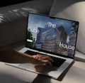 Laptop with The CubeHouse website on screen