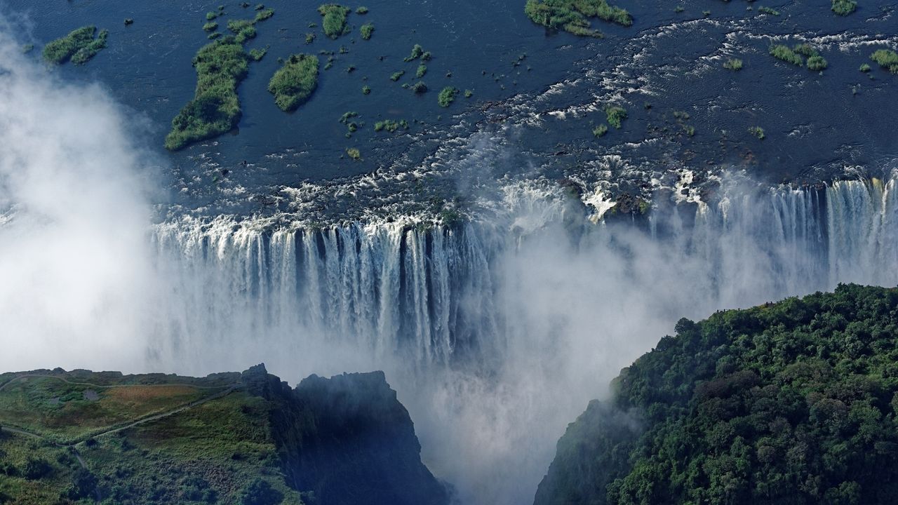 An aerial view of Victoria Falls with spray 