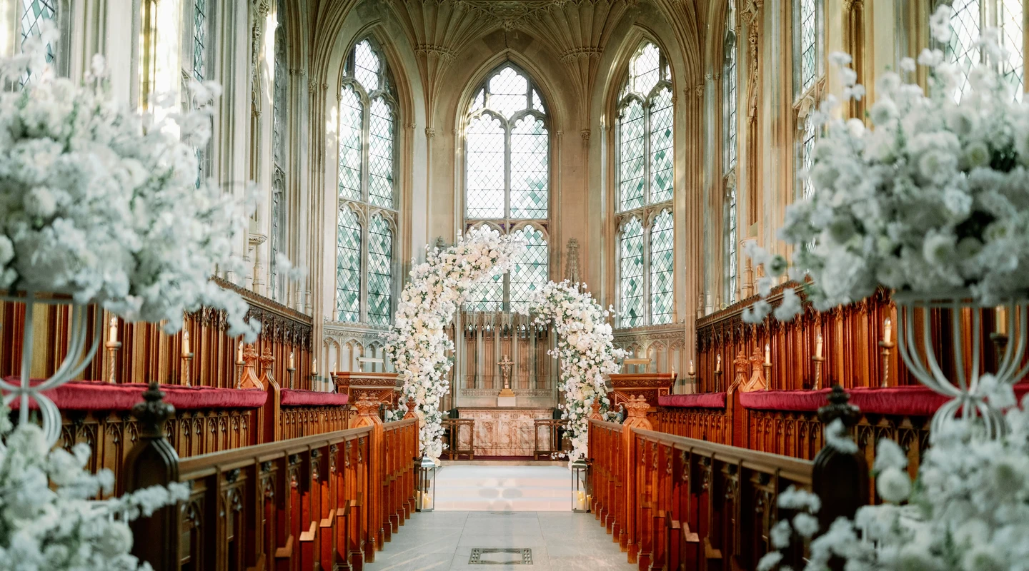 The chapel with green stained glass and white floral decorations