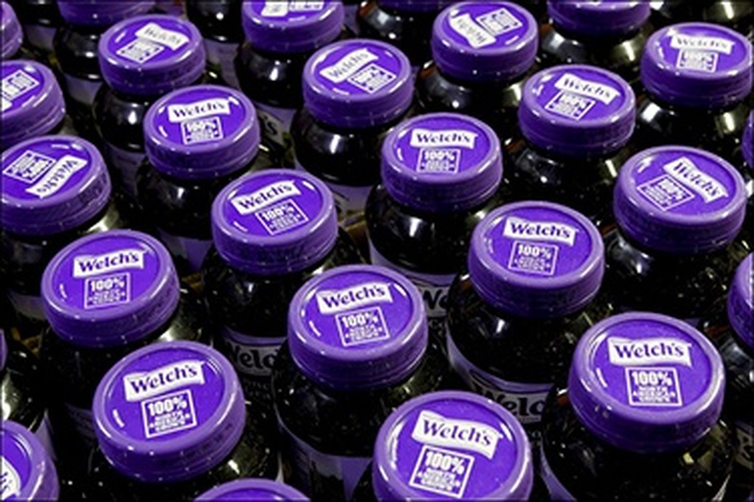 Aerial view of Welch's 100% Concord Grape Juice bottles.