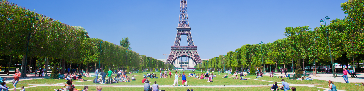 A sunny day on Champ de Mars next to the Eiffel Tower