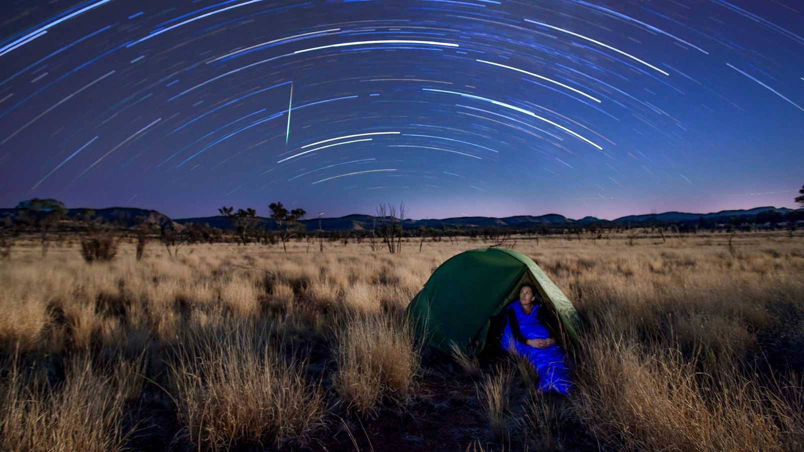 star timelapse over a camping woman around alice springs,-d-,jpg
