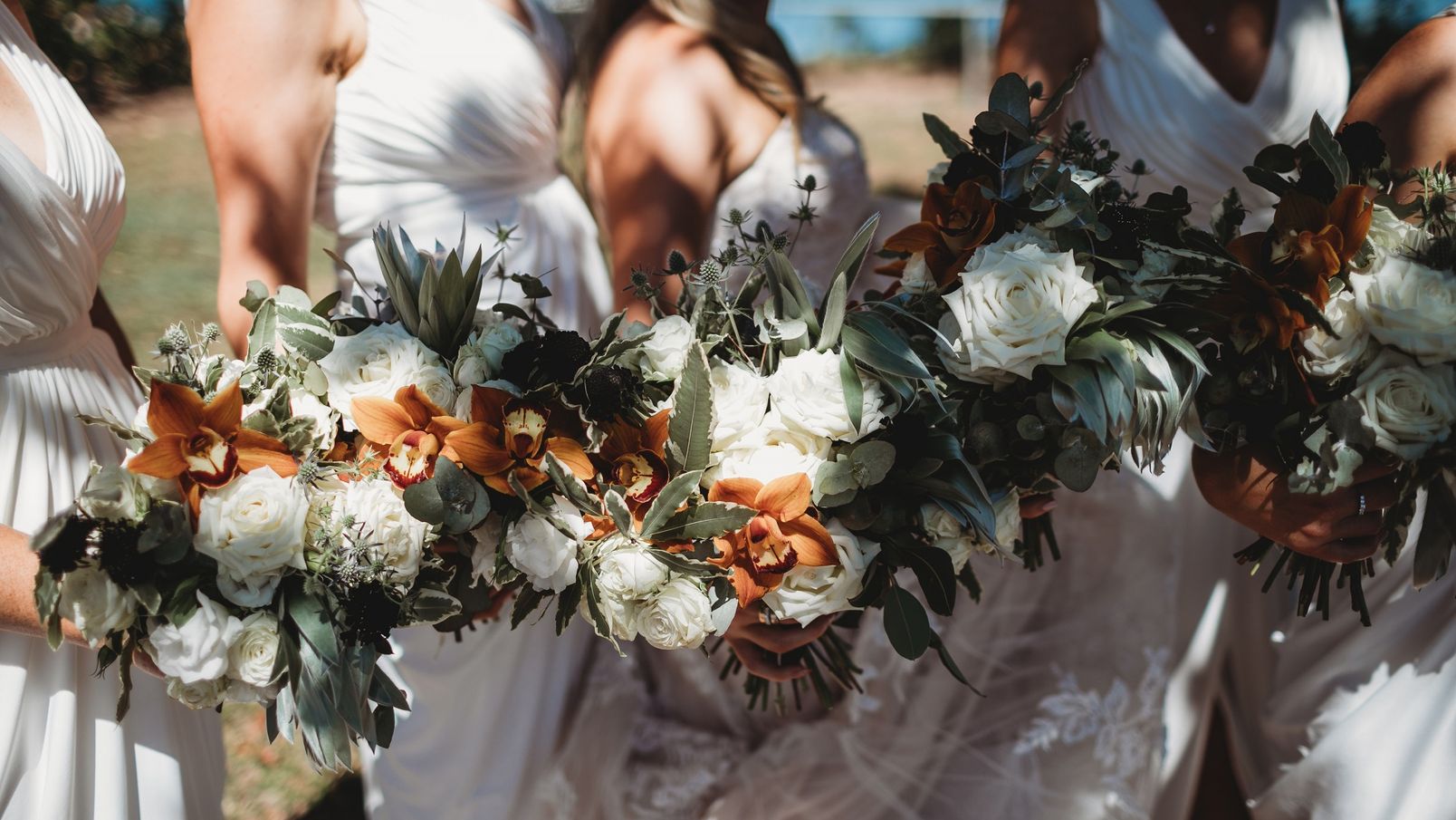 The bridesmaids with their flower bouquets