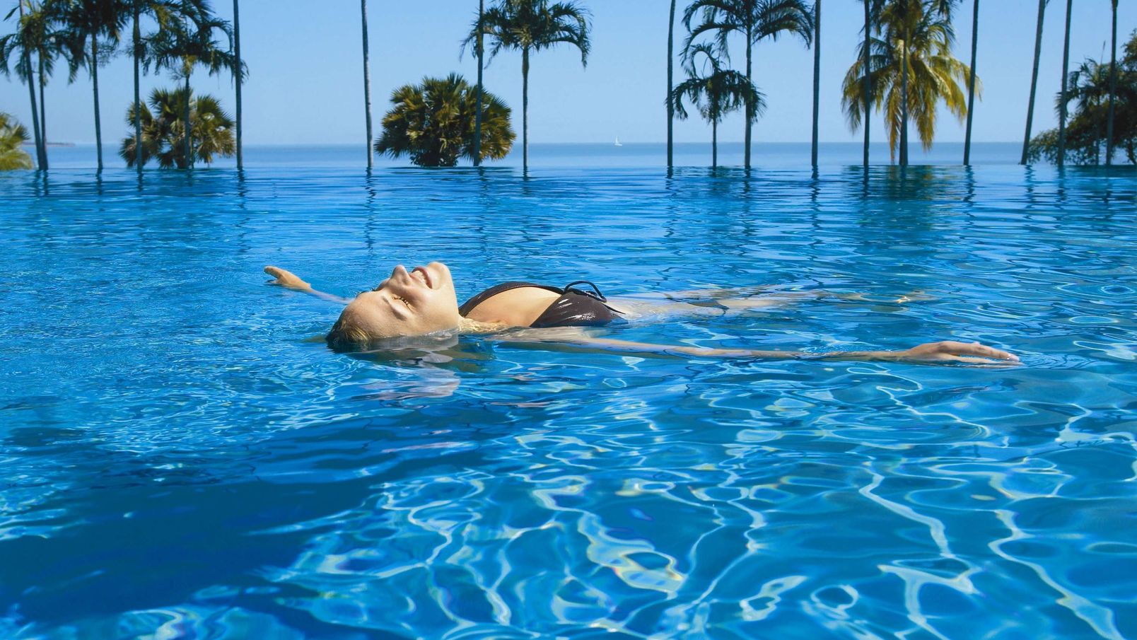 A woman relaxing in the pool at Skycity Darwin