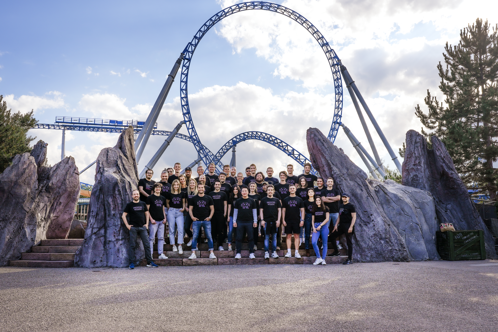 holoride team in front of a rollercoaster