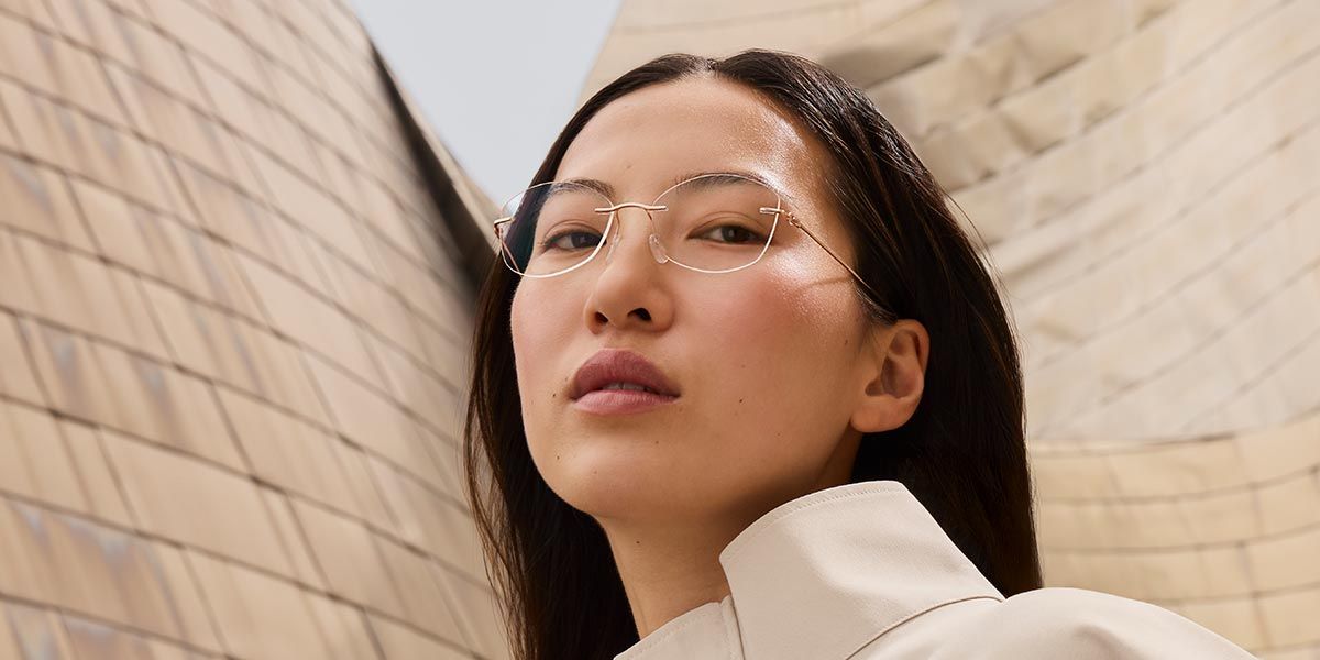 Woman in front of the Guggenheim Bilbao Museum wearing The Refined collection