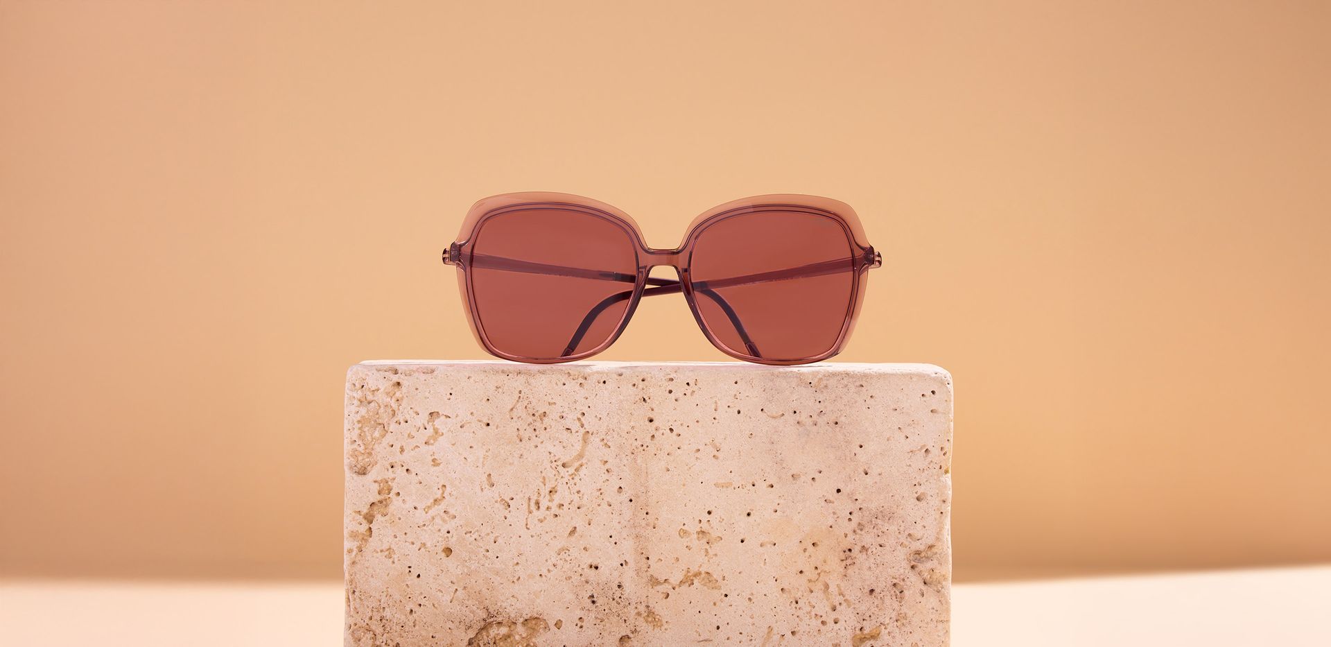 People at the beach wearing sunglasses