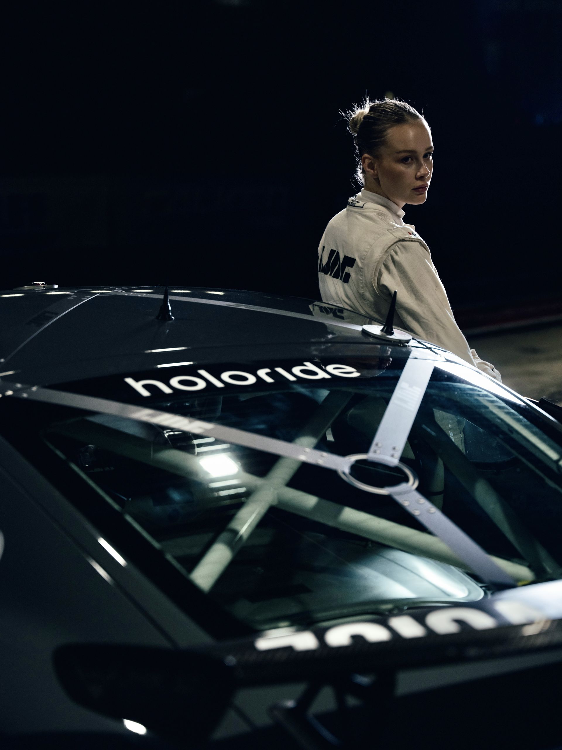 Laura-Marie-Geissler with Porsche car and holoride branding