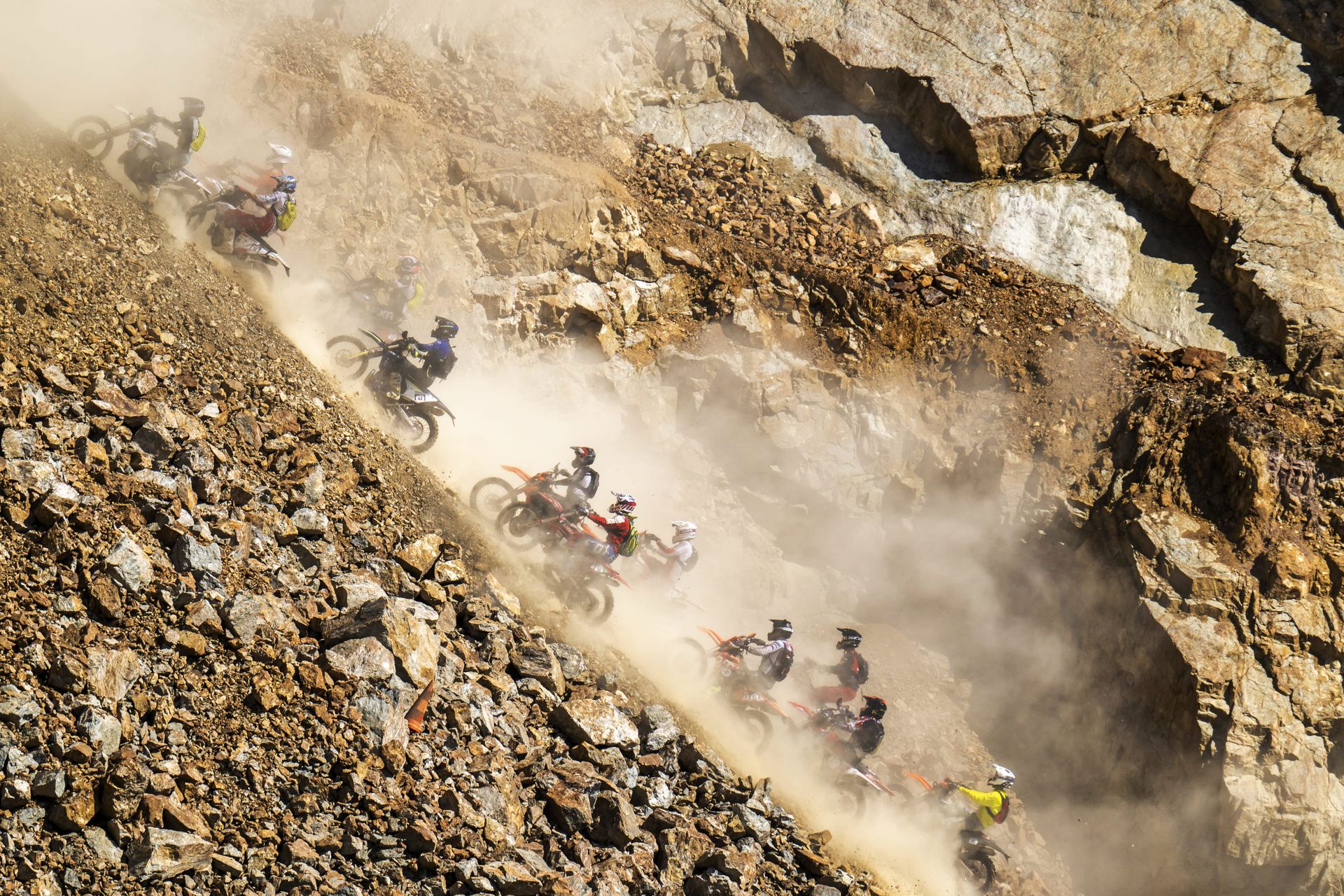riders driving up a mountain