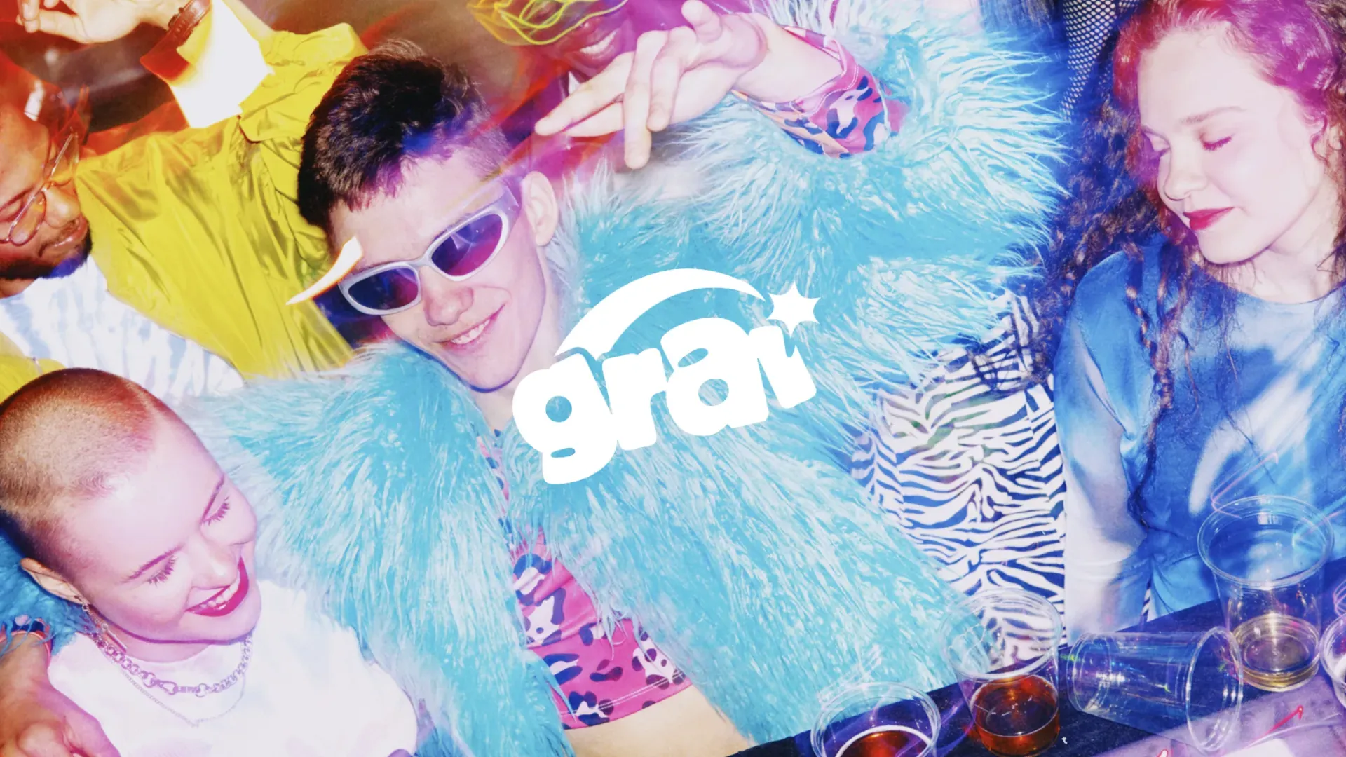 GRAI logo over young friends dancing at a party, capturing the shared listening its social streaming service is built for