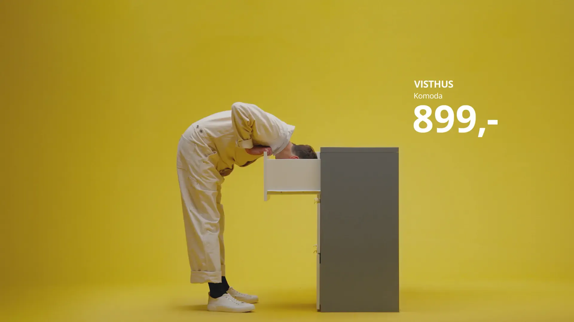 Person leaning into a VISTHUS dresser drawer on yellow with product price, from the Sound of IKEA campaign
