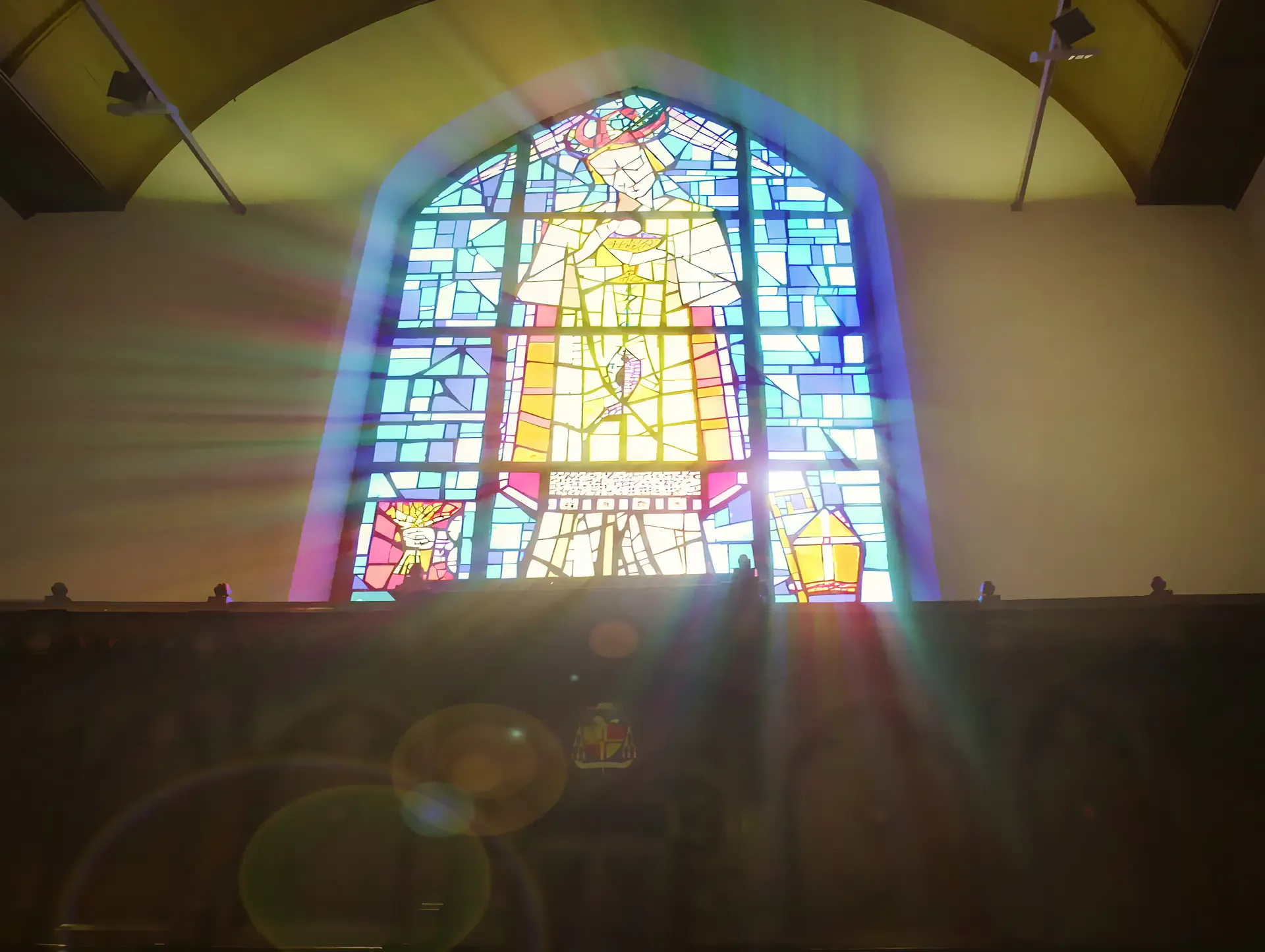 Sunlight through a stained glass window in an abbey, from the Sound of Leffe campaign