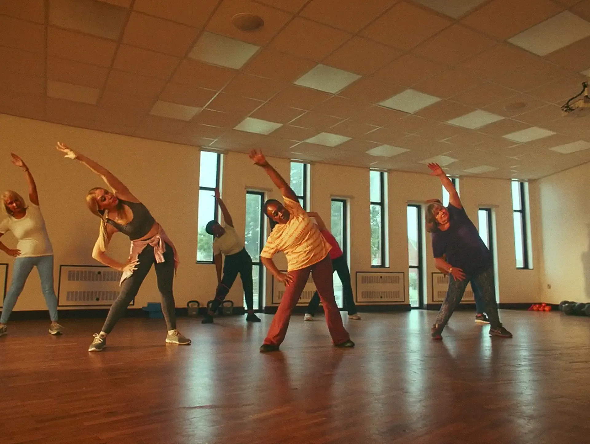 Group stretching in a sunlit studio room in the This Girl Can campaign film