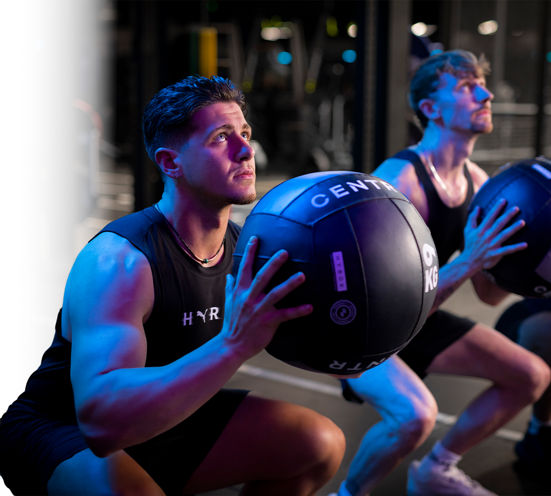 A man prepaing to throw a 6kg wall ball