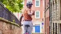 Man riding a Raleigh Motus electric bike