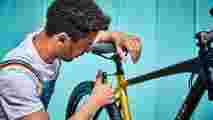 A man fixing a Raleigh Strada bike 