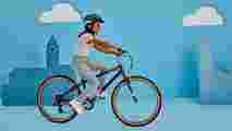 A girl riding the Raleigh POP kids bike