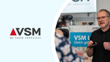 VSM logo with man next to it