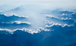 Clouds resting on mountains