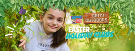 A girl in a white hoodie smiles through leaves. Text: "Easter Holiday Clubs" with logos "Holiday HQ" and "Great Outdoors." Leafy border accents.