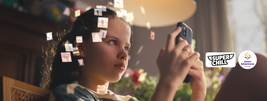 A girl using a smartphone, surrounded by floating digital images. Logos of "Super Chill" and "Junior Adventures Group" are visible.