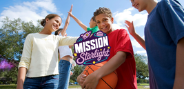 A group of smiling teenagers outdoors, one holding a basketball, with trees and a blue sky in the background. "Mission Starlight" logo overlay.