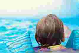 Child having swimming lesson