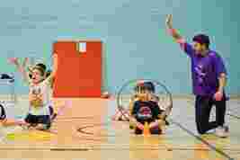 JAG staff and children in a sports hall