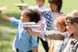 kids with paper planes