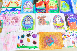 A collection of colorful children's artwork featuring bunnies, Easter eggs, rainbows, and abstract designs, some with glitter.