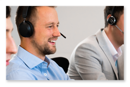 CX agent smiles after resolving customer contacts