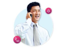 Man smiles whilst on the phone with customer service agents