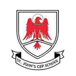 Emblem of St. John's CEP School featuring a red eagle with a halo inside a shield, with a banner below.