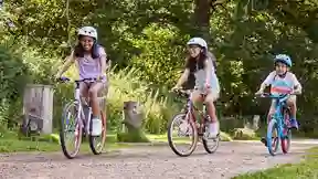 Kids riding Raleigh Pop bikes outdoors